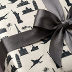 Travel wrapping paper with black landmarks and a grey ribbon, unique gift wrap by Wrapped Studios.