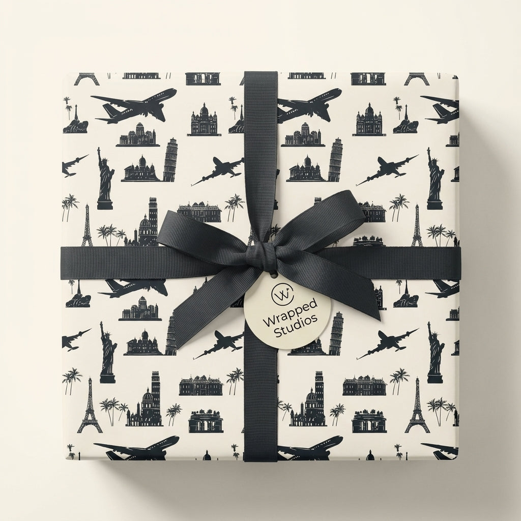 Minimalist travel wrapping paper with black world landmarks and a chic ribbon bow by Wrapped Studios.