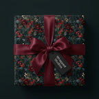 Luxury dark floral Christmas wrapping paper with burgundy satin ribbon, by Wrapped Studios.
