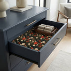 Vintage floral wrapping paper used as a moody drawer liner by Wrapped Studios.