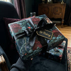 Luxury dark floral wrapping paper with a black satin ribbon and gift tag by Wrapped Studios.