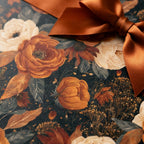 Luxury vintage floral gift wrap with burnt orange flowers and a satin copper ribbon by Wrapped Studios.