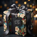 Luxury dark floral wrapping paper with a grey satin bow on a gift box, by Wrapped Studios.
