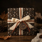 Rustic vintage floral wrapping paper with a cream velvet bow on a gift box by Wrapped Studios.