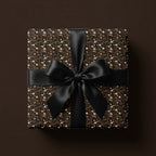 Luxury dark floral wrapping paper with white daisies and a black satin bow by Wrapped Studios.