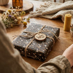 Rustic vintage floral wrapping paper by Wrapped Studios on a gift box tied with twine.