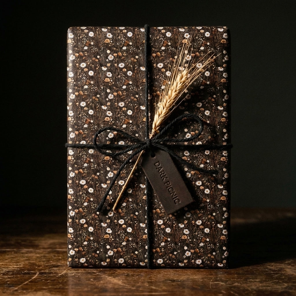 Rustic dark floral wrapping paper with white daisies and black twine by Wrapped Studios.