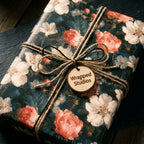 Luxury vintage floral wrapping paper with coral flowers and rustic twine bow by Wrapped Studios.