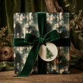 Rustic forest Christmas gift wrap by Wrapped Studios, featuring a green velvet bow and tree tag.