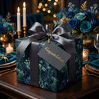 Luxury dark floral wrapping paper with a grey satin bow and congratulations tag by Wrapped Studios.