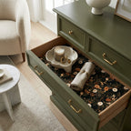 Moody dark floral wrapping paper used as a luxury drawer liner in an olive green dresser, by Wrapped Studios.