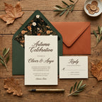 Rustic autumn wedding invitation suite with green floral envelope liner on wood by Wrapped Studios.