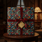 Unique vinyl record pattern wrapping paper with dark red velvet ribbon for a music lover's gift.