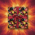 Square gift wrapped in record-themed birthday wrapping paper with a red ribbon.