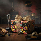 Music themed gift with record wrapping paper and gold ribbon on a stage.