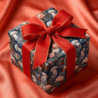 Coastal Christmas wrapping paper with jellyfish print and red bow, luxury holiday gift wrap by Wrapped Studios.