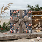 Coastal Christmas wrapping paper with jellyfish pattern and grey velvet bow by Wrapped Studios.