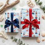 Nautical wrapping paper with lighthouses and sailboats by Wrapped Studios, tied with red and navy satin bows.
