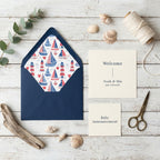 Nautical sailboat wrapping paper pattern inside a navy envelope liner for invitations by Wrapped Studios.