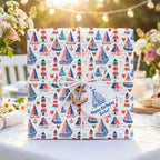 Nautical birthday wrapping paper with sailboats, lighthouses, twine, and anchor tag by Wrapped Studios.