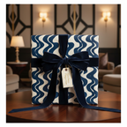 Luxury modern wavy pattern wrapping paper with a dark blue velvet ribbon and gift tag, perfect for elegant gifts.