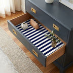 Nautical navy blue and white striped wrapping paper used as a drawer liner, by Wrapped Studios.