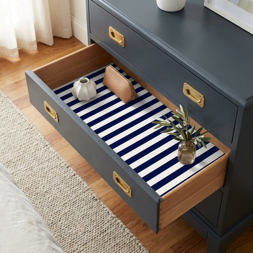 Nautical navy blue and white striped wrapping paper used as a drawer liner, by Wrapped Studios.