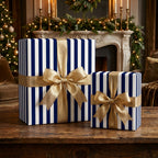 Navy blue striped Christmas wrapping paper with gold ribbon by Wrapped Studios.