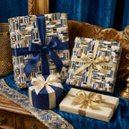 Luxury geometric wrapping paper in navy and gold by Wrapped Studios, featuring elegant gift boxes with silk ribbons.