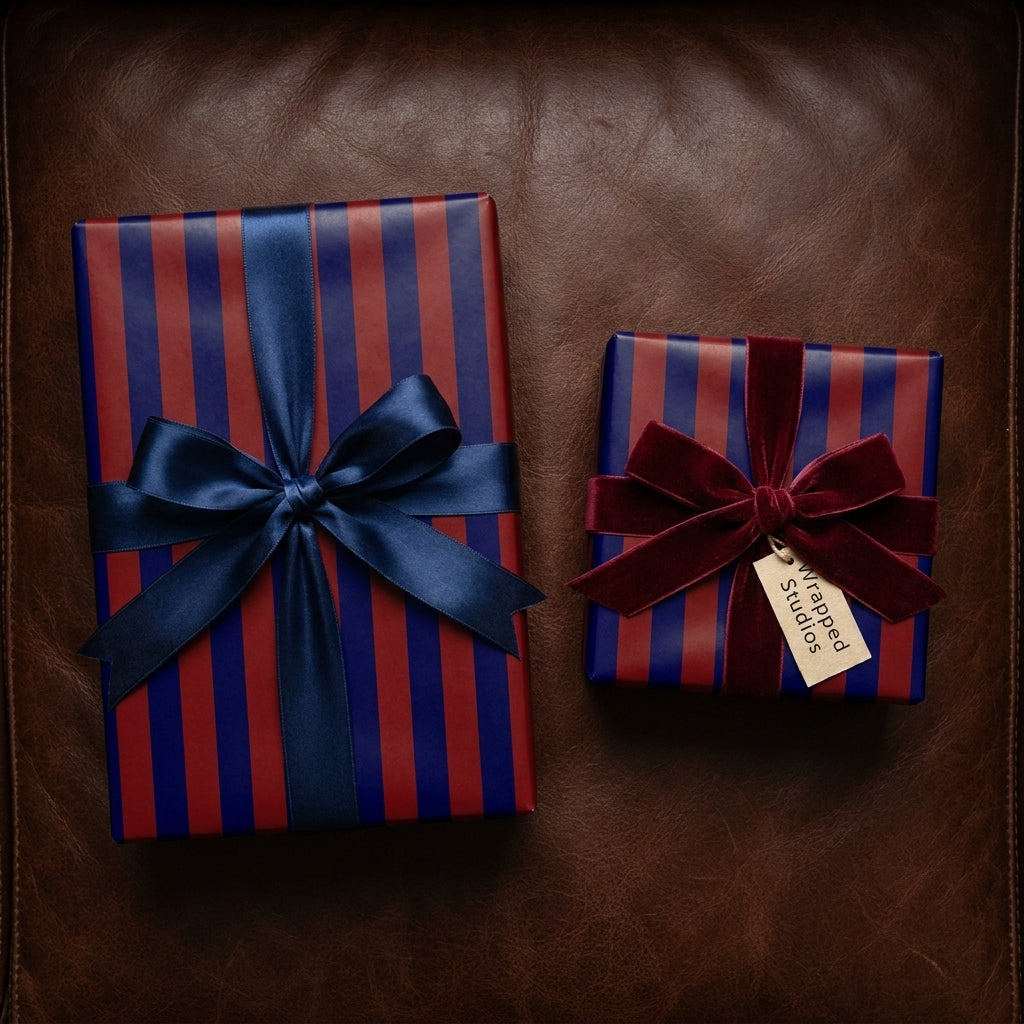 Luxury red and navy striped wrapping paper with elegant satin and velvet bows by Wrapped Studios.