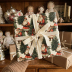 Vintage Santa Claus Christmas wrapping paper with a cream velvet bow by Wrapped Studios.