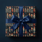 Luxury navy blue nutcracker Christmas gift wrap with satin bow by Wrapped Studios.