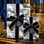 Luxury blue and gold marble wrapping paper with navy velvet bows by Wrapped Studios.