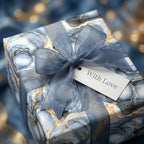 Blue and gold marble luxury gift wrap with a sheer ribbon bow and 'With Love' tag by Wrapped Studios.