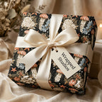 Luxury jellyfish wrapping paper with cream satin bow and gift tag by Wrapped Studios.