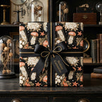 Vintage gothic wrapping paper with jellyfish and black bow on a luxury gift box by Wrapped Studios.