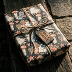 Vintage ocean wrapping paper with jellyfish on a rustic gift box by Wrapped Studios.