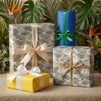 Luxury water ripple wrapping paper on elegant gift boxes with satin bows by Wrapped Studios.