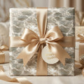 Luxury wedding gift wrap with elegant water ripple pattern and champagne satin bow by Wrapped Studios.