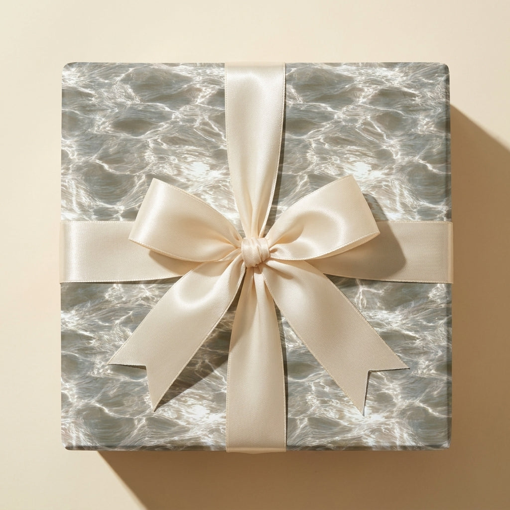 Luxury water ripple wrapping paper with a cream satin ribbon by Wrapped Studios.