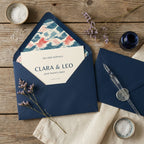 Coastal wedding invitation with wave patterned envelope liner by Wrapped Studios.