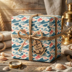 Nautical ocean wave wrapping paper in blue and coral with twine bow and Bon Voyage tag by Wrapped Studios.