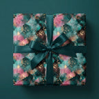 Luxury abstract wrapping paper in emerald, pink, and gold with a green satin ribbon by Wrapped Studios.
