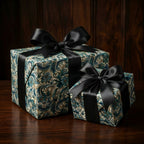 Two gifts wrapped in elegant floral wrapping paper with black satin ribbons.