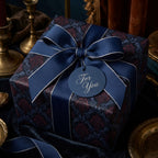 Elegant gift wrapped in floral wrapping paper with a navy ribbon and "For You" tag, perfect for special occasions.