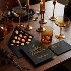 Elegant black and gold birthday invitation with balloon envelope liner by Wrapped Studios.