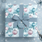 Dusty blue Christmas gift wrap with watercolor ornaments and ribbon from Wrapped Studios.