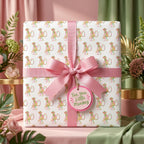 Cute monkey baby shower wrapping paper with a pink bow by Wrapped Studios.