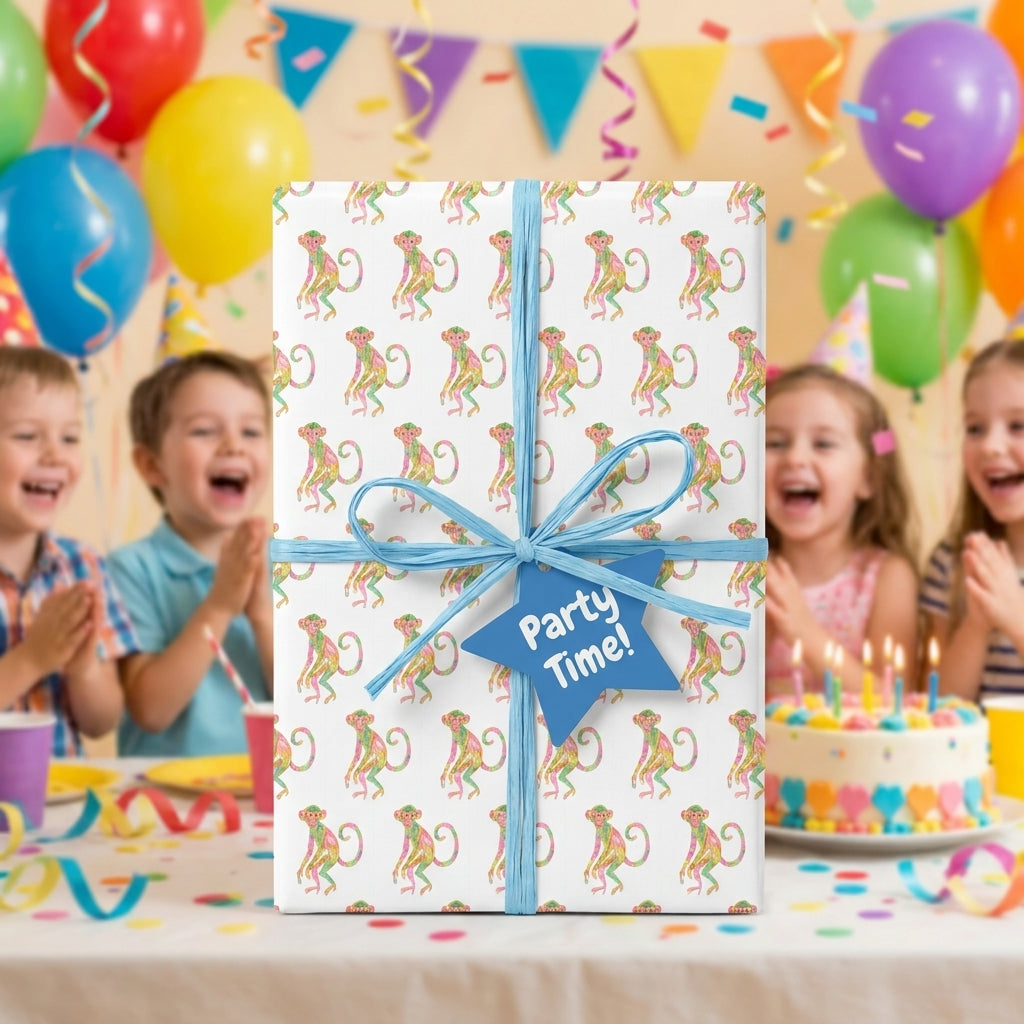 Playful monkey birthday wrapping paper with a blue bow at a kids party, by Wrapped Studios.