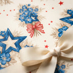 Vintage patriotic wrapping paper with blue stars and flowers, tied with cream ribbon by Wrapped Studios.